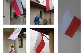 na zdjęciu widać uczni&oacute;w z flagami Polski